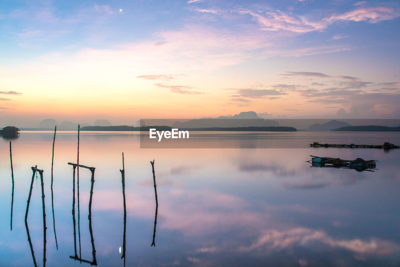 Scenic view of lake against sky during sunset