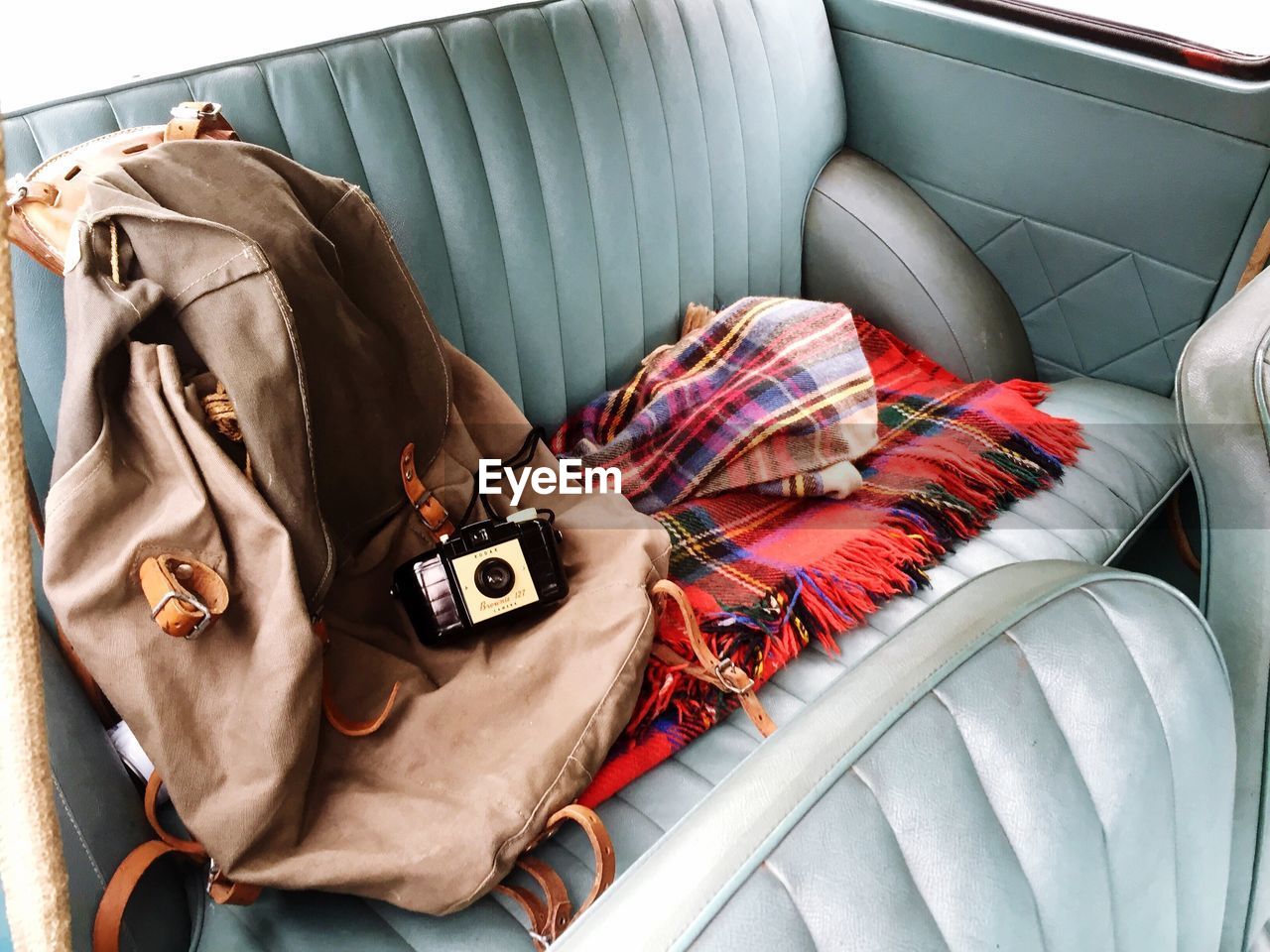 Bag and camera on car seat