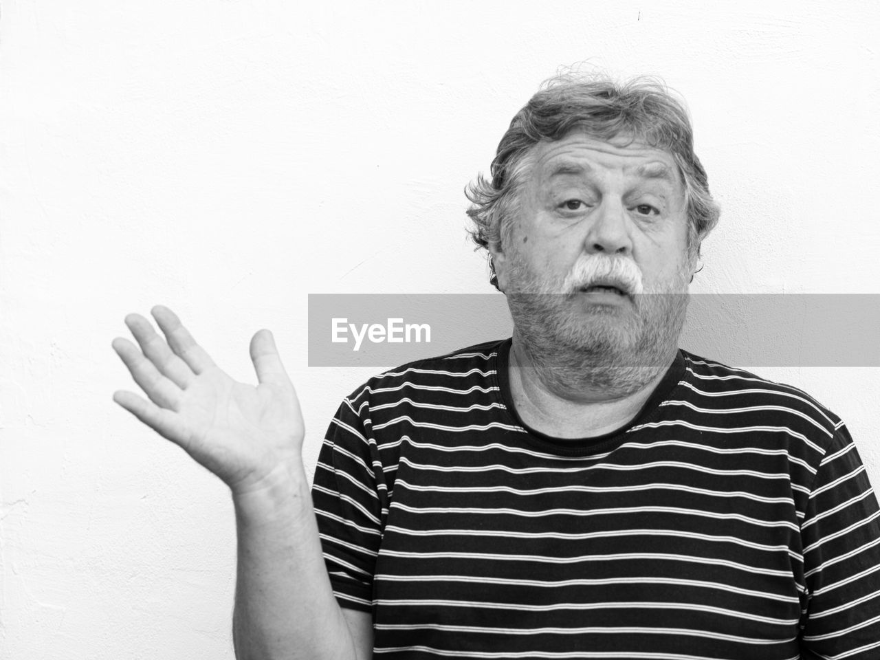 PORTRAIT OF MAN WEARING MASK STANDING AGAINST WALL