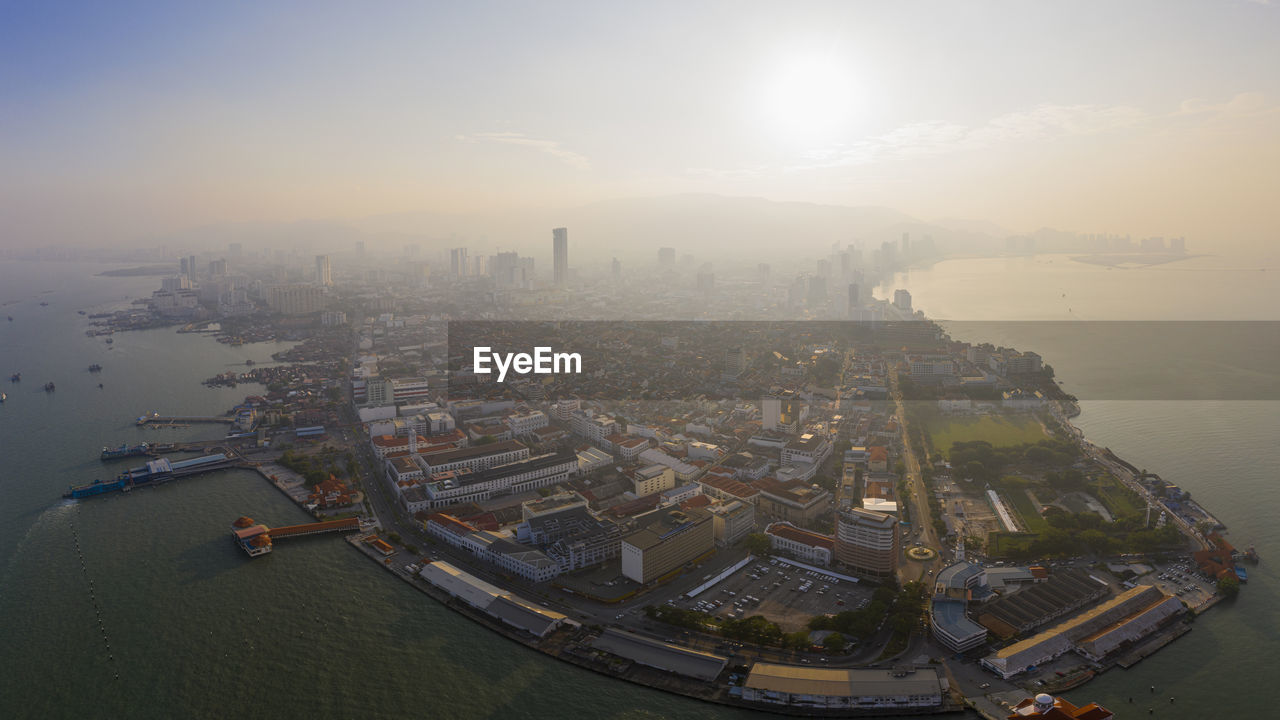 High angle view of city buildings during sunset