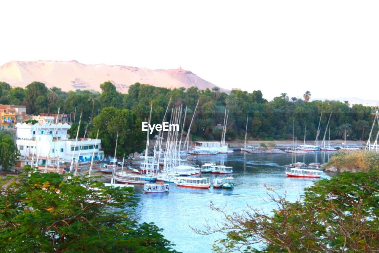 BOATS MOORED IN HARBOR