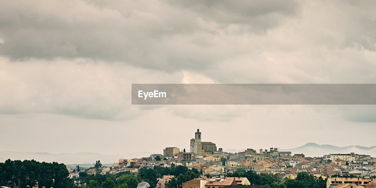 High angle view of buildings in city against sky