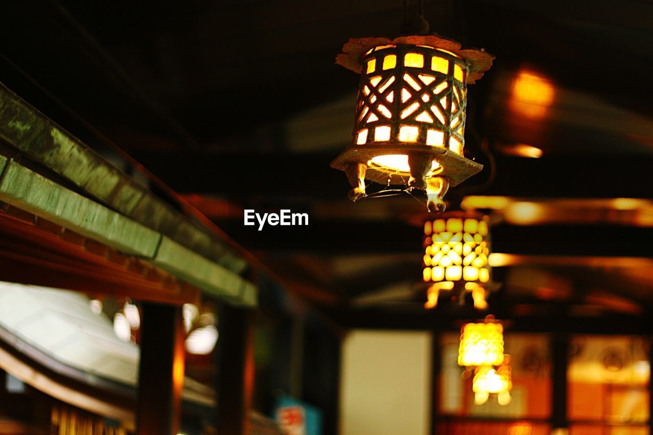 LOW ANGLE VIEW OF HANGING LIGHTS HANGING ON CEILING