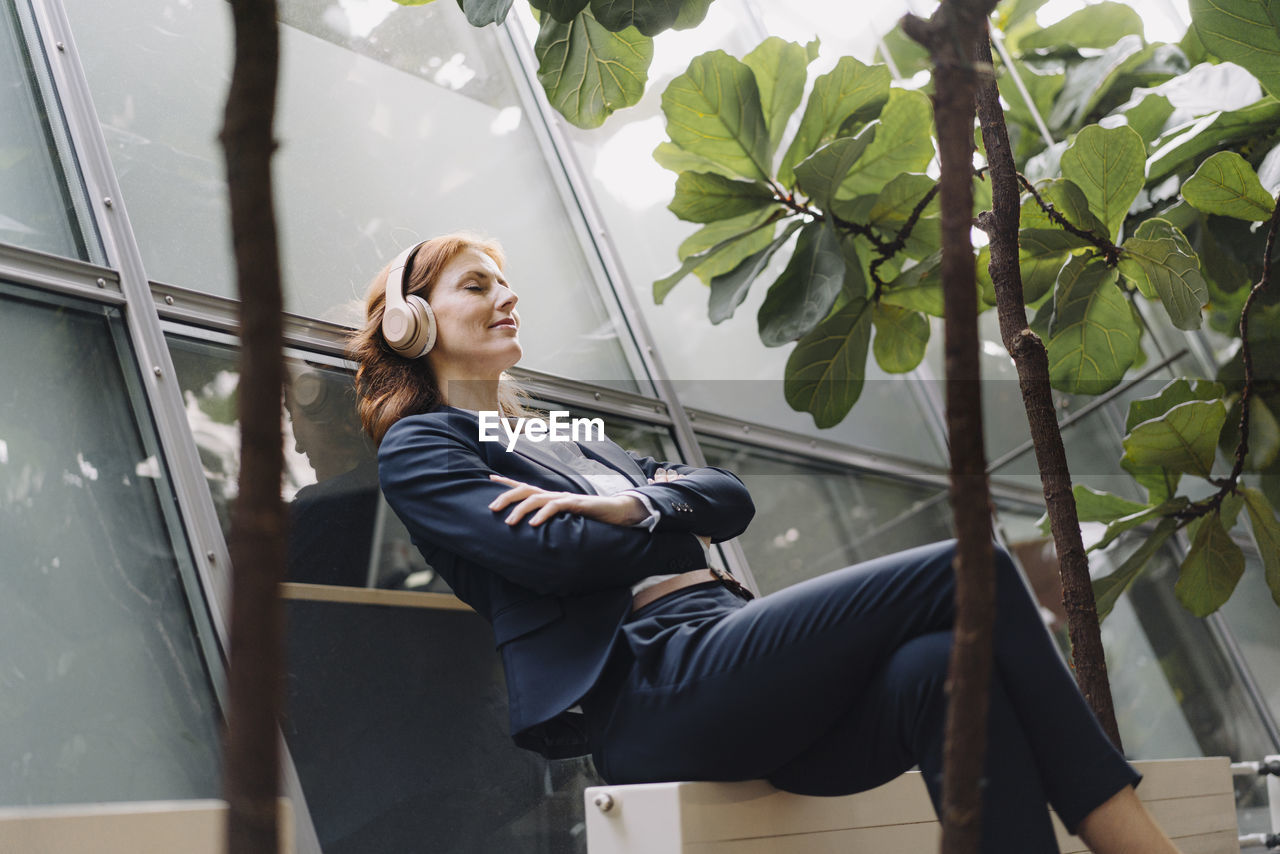 Businesswoman having a break in a modern office building