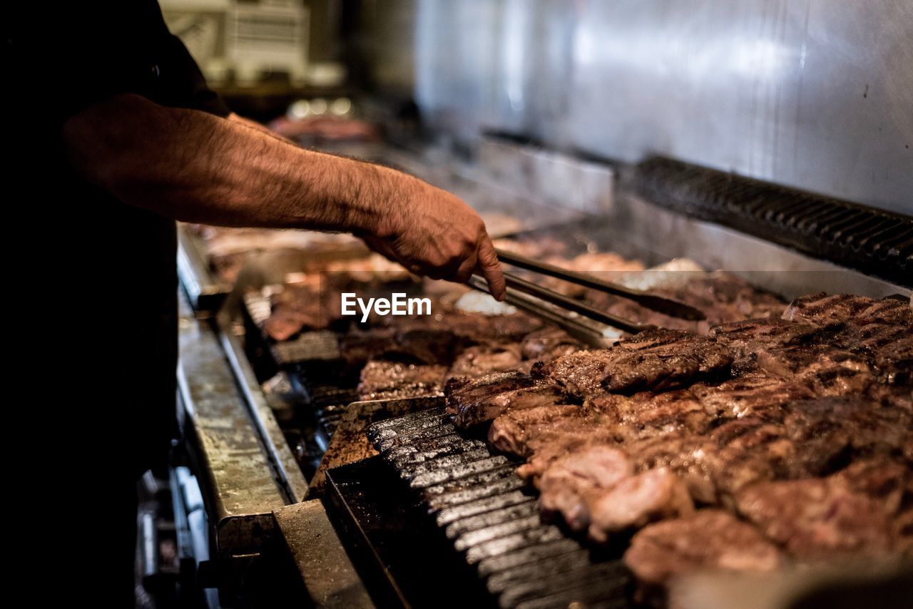 Close-up of man preparing food