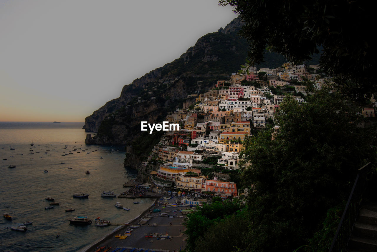 High angle view of buildings by sea against sky in positano