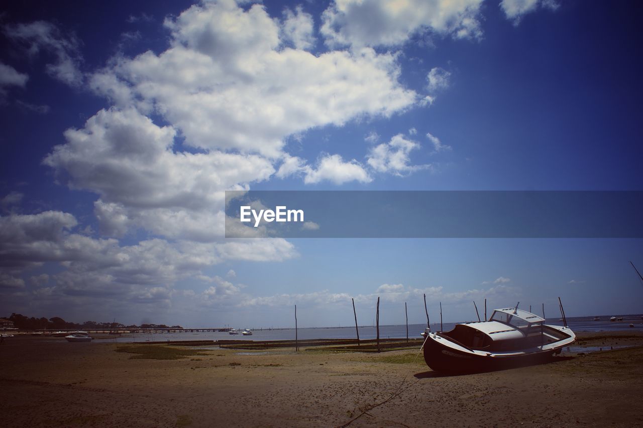 Abandoned boat on shore