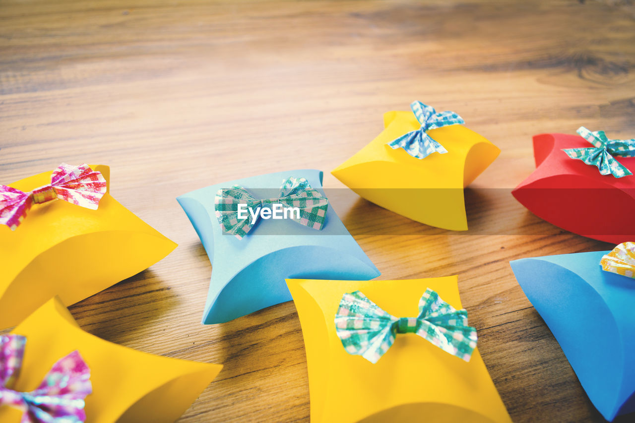 Close-up of colorful gift boxes on wooden table