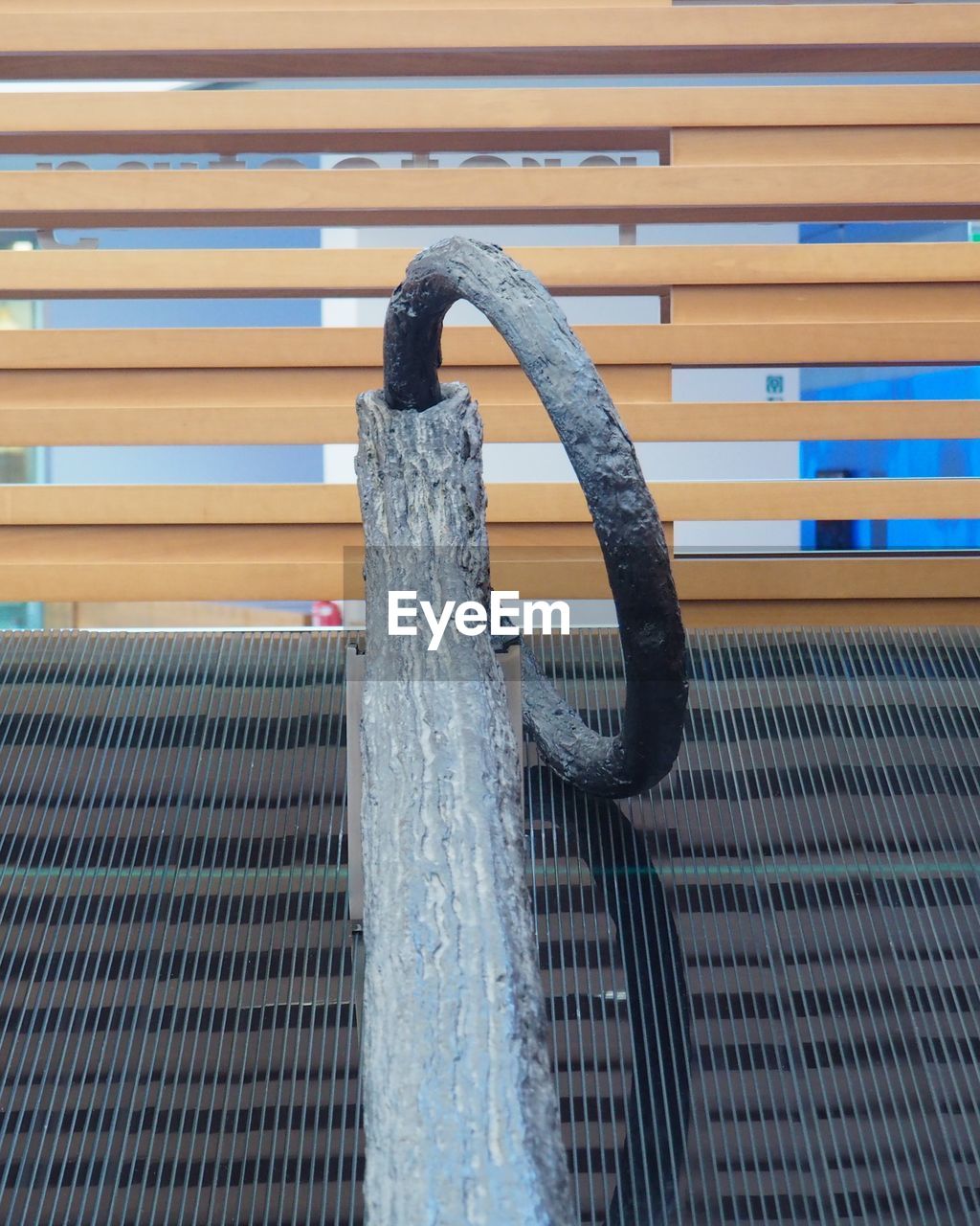 CLOSE-UP OF WET METAL RAILING