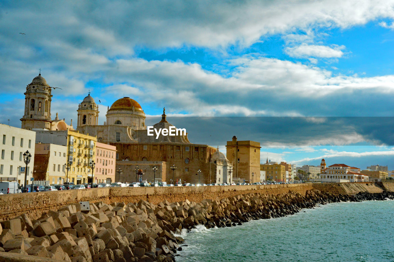 Town against cloudy sky