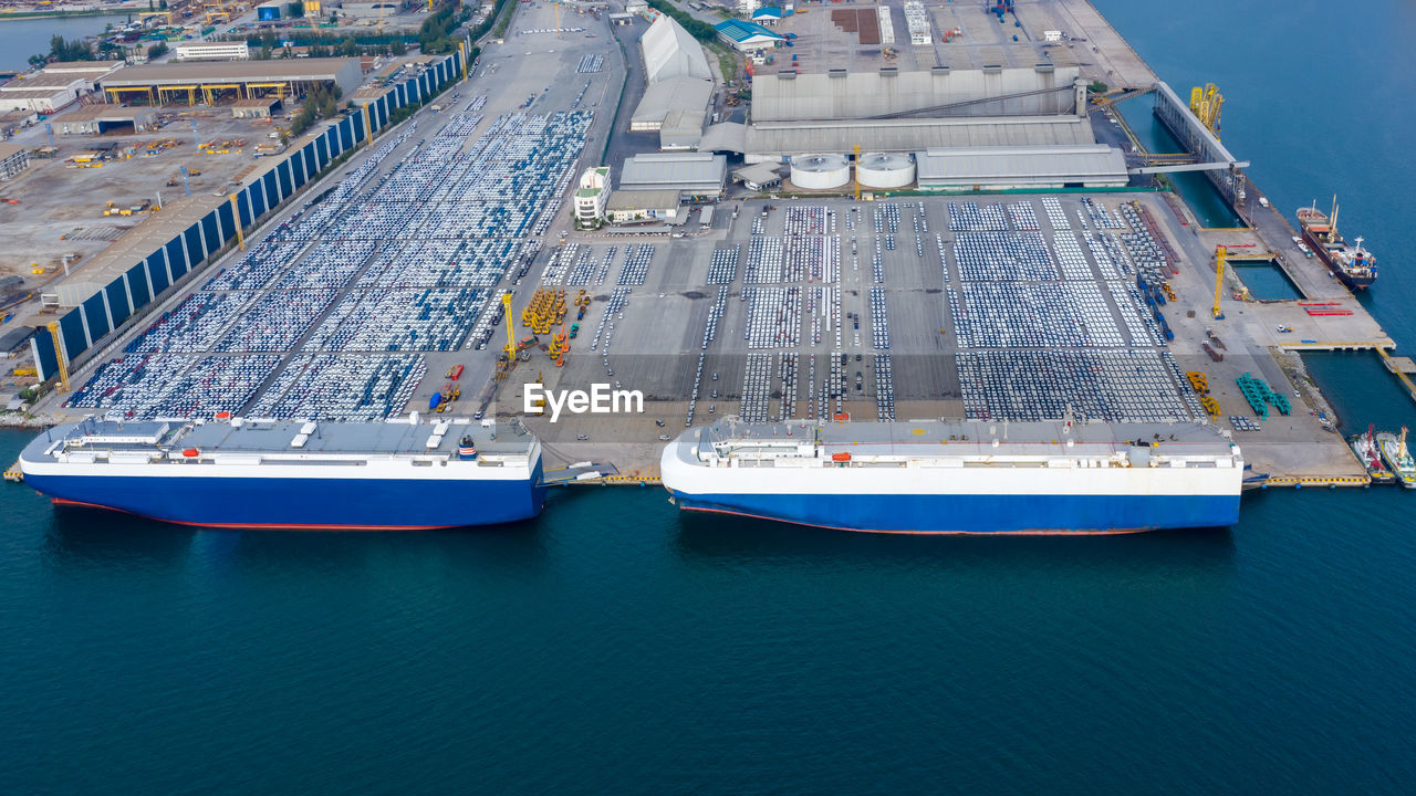 Aerial view car loading to large roro roll on off carrier vessel for shipping to worldwide.