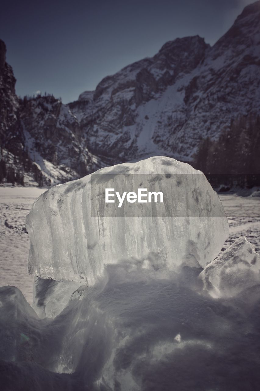 Scenic view of snow mountains against clear sky