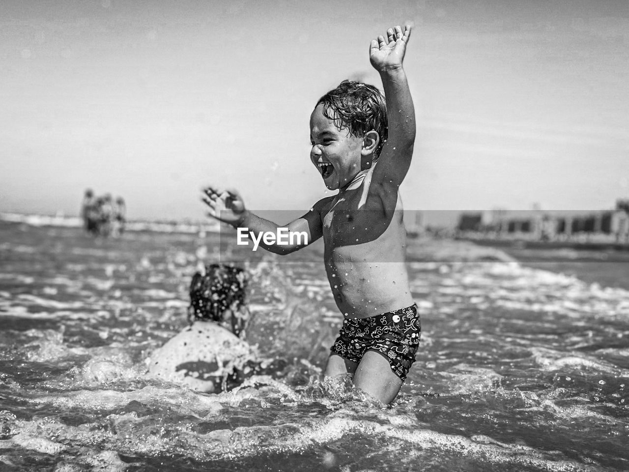 water, child, childhood, black and white, swimming, monochrome photography, motion, nature, splashing, fun, monochrome, happiness, emotion, enjoyment, one person, sea, men, lifestyles, leisure activity, female, full length, summer, day, women, swimwear, outdoors, sky, positive emotion, wet, sports, smiling, holiday, trip, vacation, white, land, black, cheerful, clothing, focus on foreground, beach, person, joy