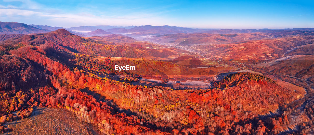 November mountain panorama. mountain autumn misty sunrise landscape. morning valley covered by fog 