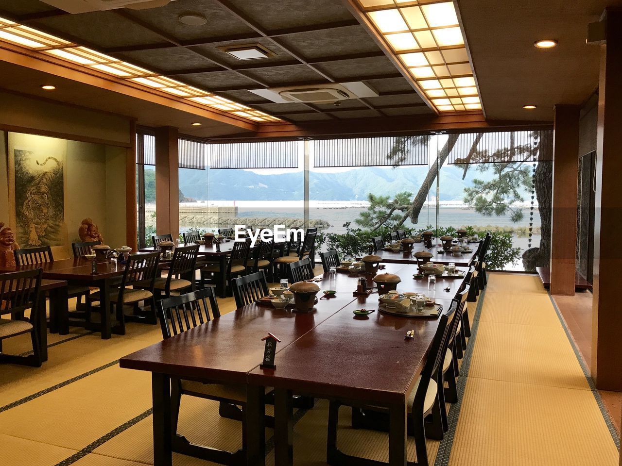 EMPTY TABLES AND CHAIRS AT RESTAURANT