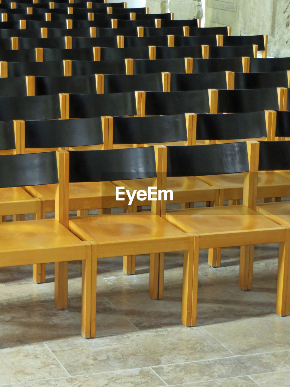 CLOSE-UP OF EMPTY CHAIRS AND TABLES