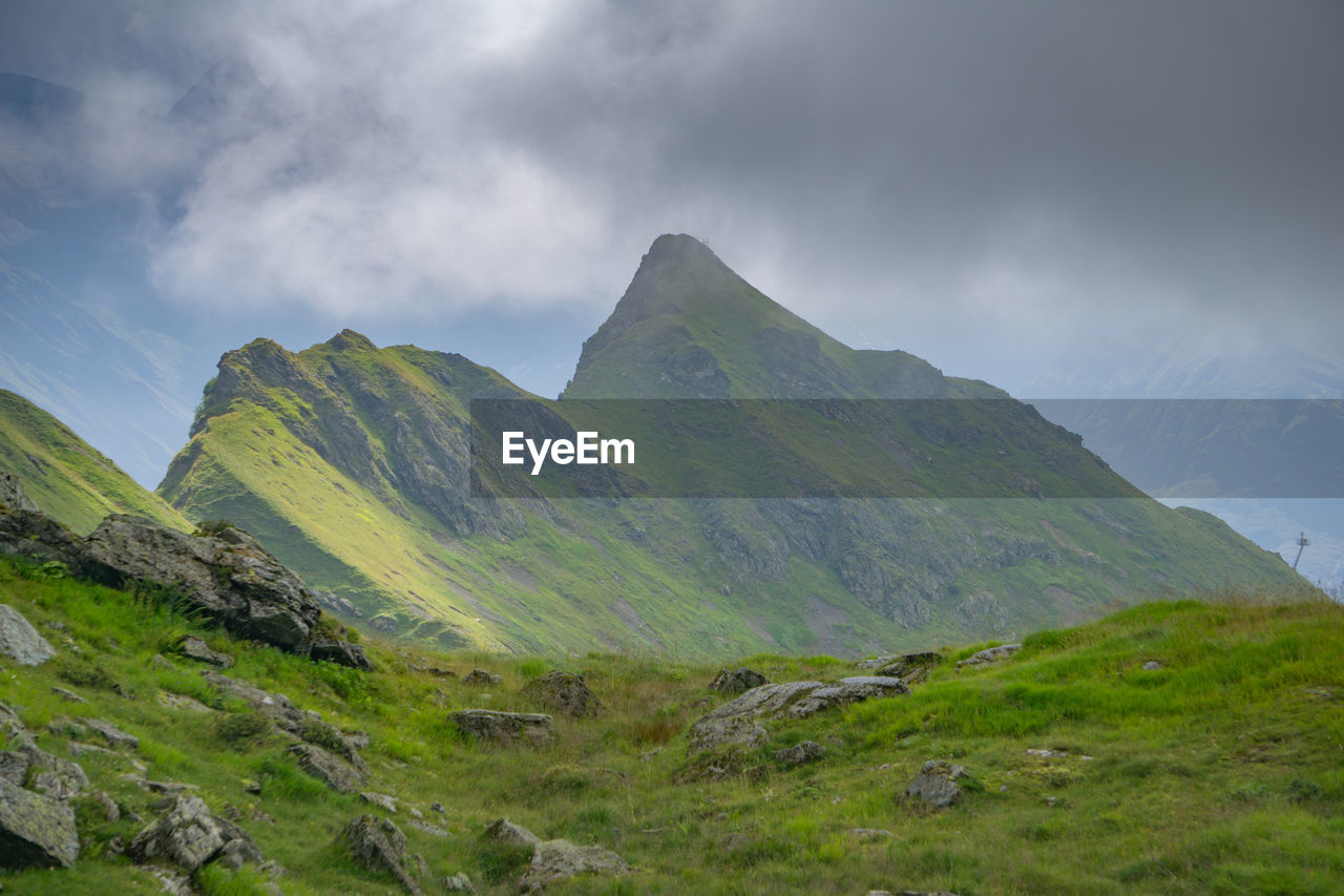 SCENIC VIEW OF MOUNTAIN AGAINST SKY