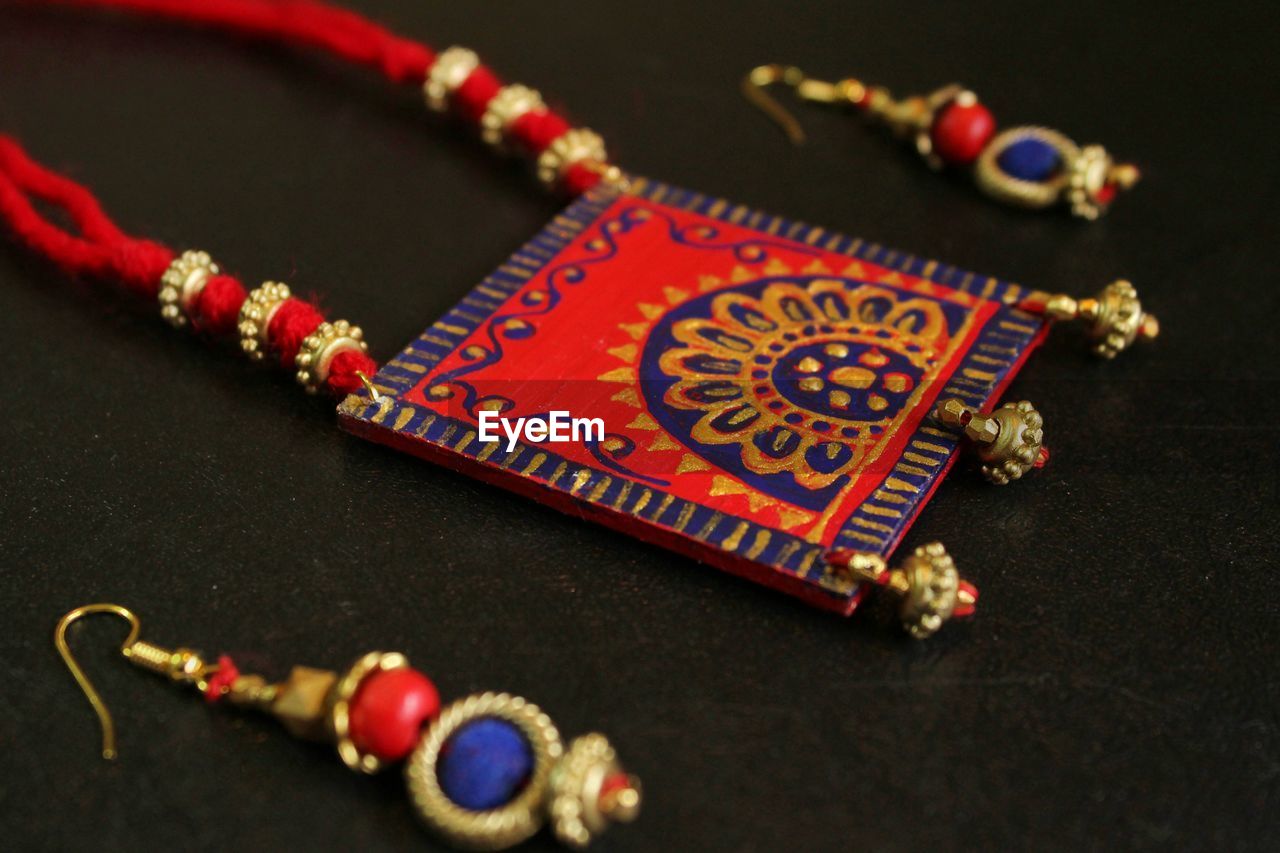 High angle view of jewelry on table