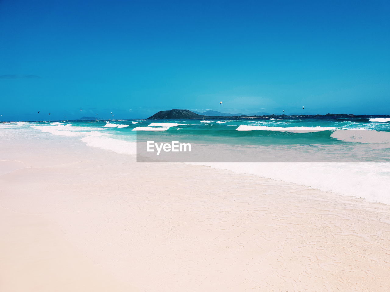 SCENIC VIEW OF BEACH AGAINST CLEAR SKY