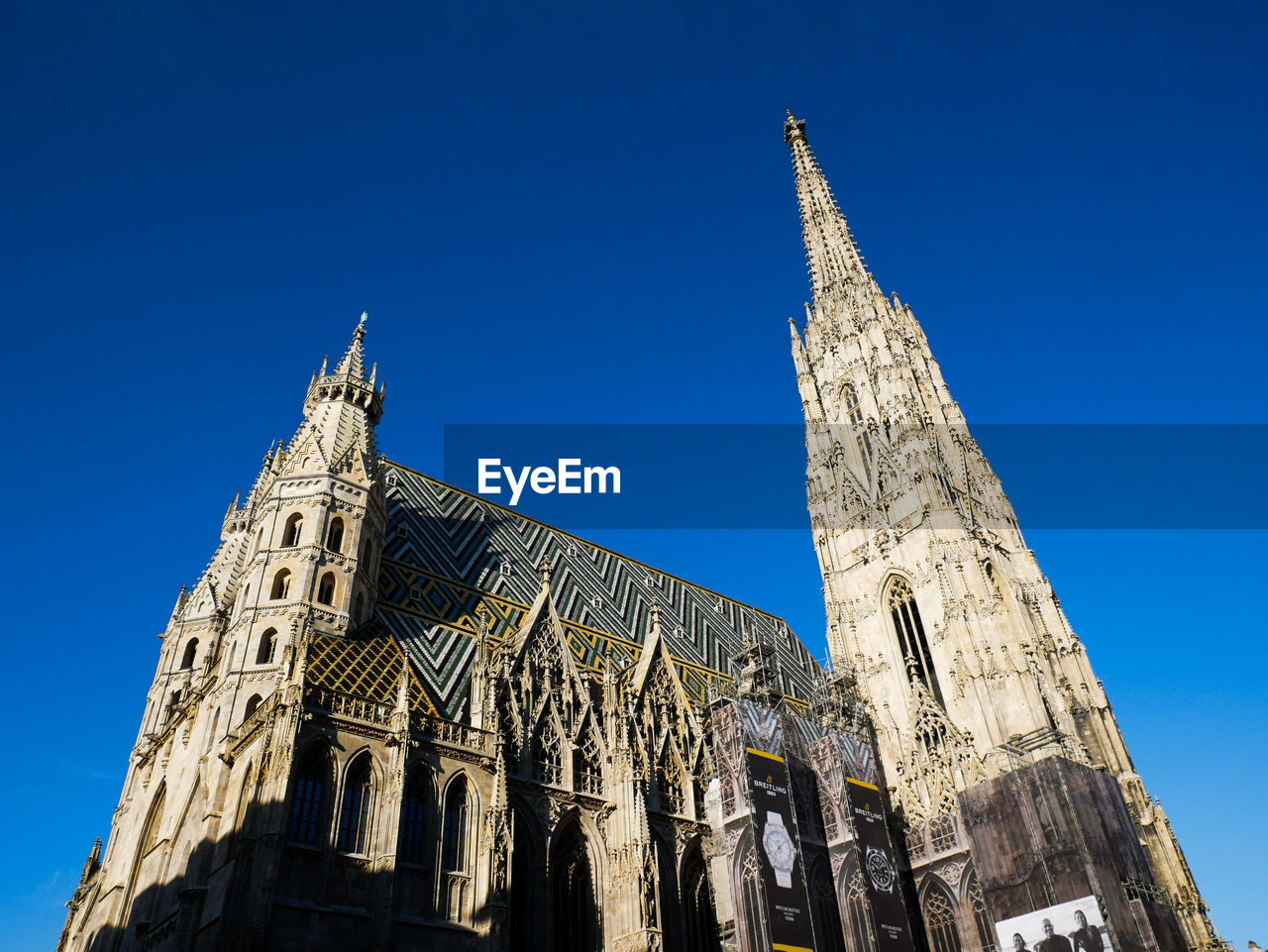 Low angle view of temple building against clear blue sky in wien