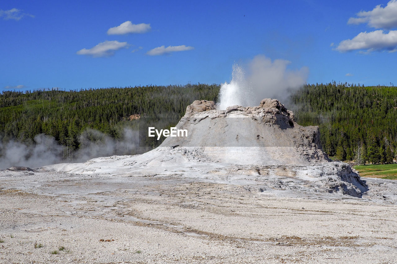 Small geyser erupting in the old faithful geyser area in the yellowstone national park, wyoming