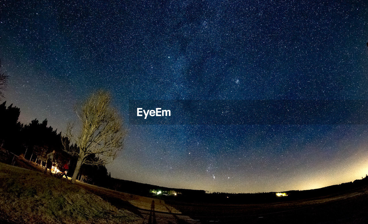 Scenic view of star field against sky at night