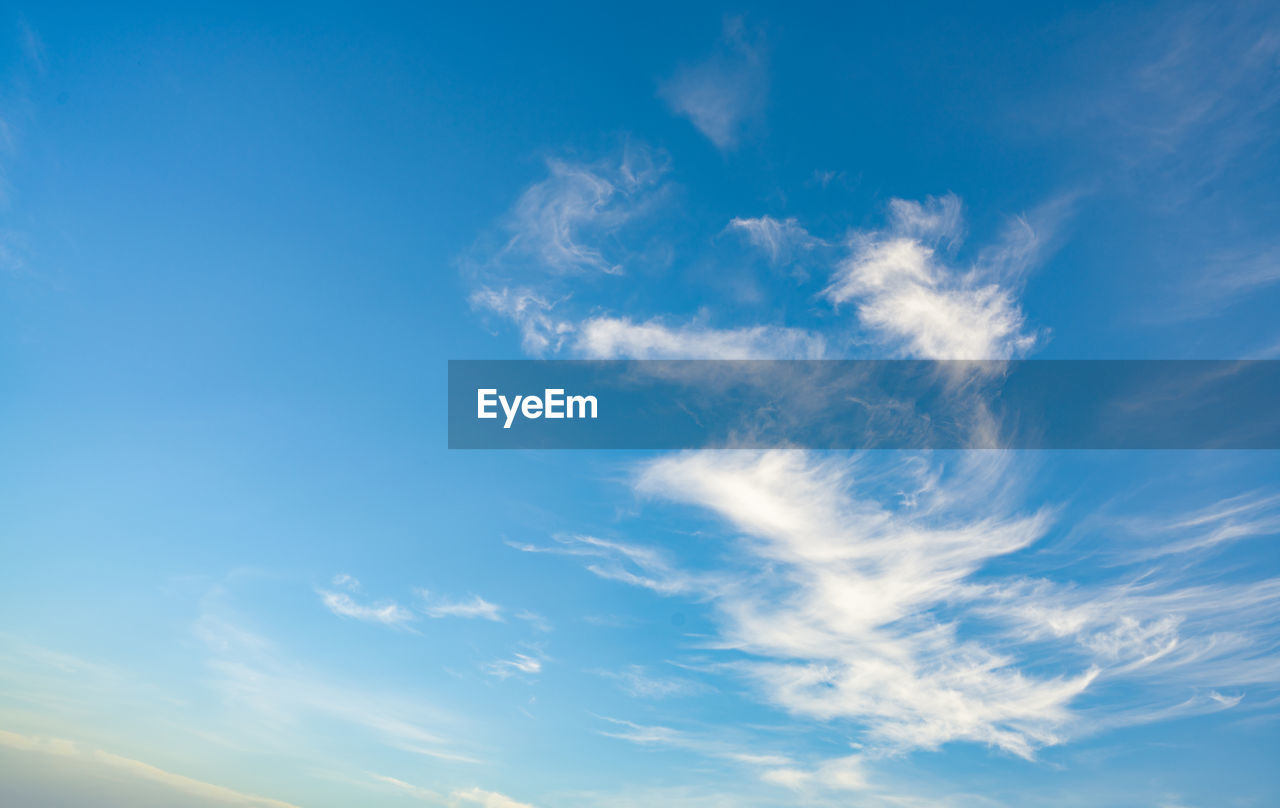 sky, cloud, blue, horizon, daytime, nature, environment, beauty in nature, cloudscape, sunlight, scenics - nature, backgrounds, atmosphere, no people, tranquility, wind, tranquil scene, dramatic sky, outdoors, idyllic, copy space, vibrant color, summer, white, climate, day, meteorology, mid-air, light - natural phenomenon, low angle view, dusk, landscape, panoramic, fluffy, bright