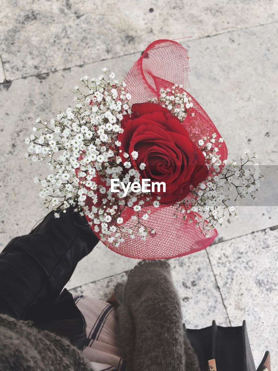 High angle view of person holding bouquet