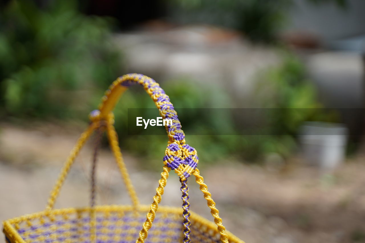 CLOSE-UP OF MULTI COLORED ROPE