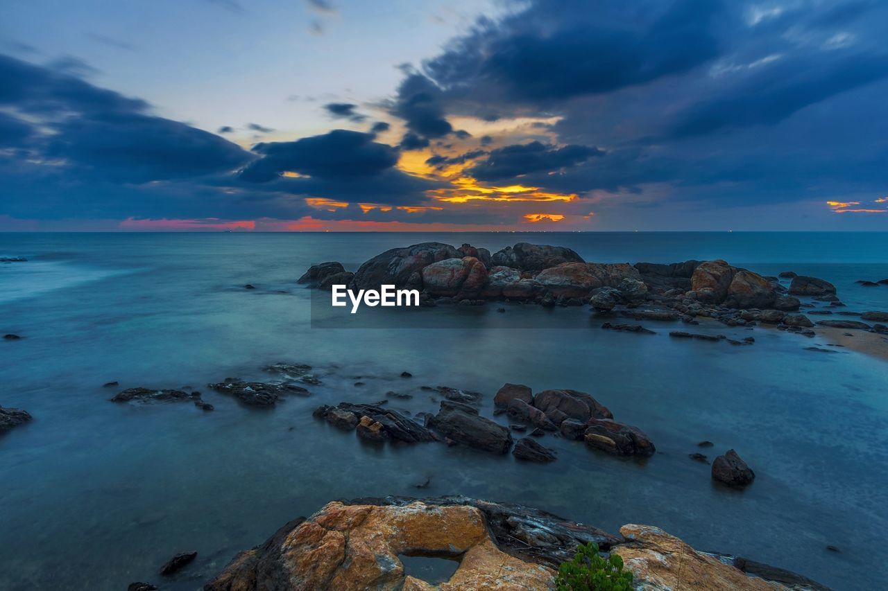 Scenic view of sea against sky during sunset