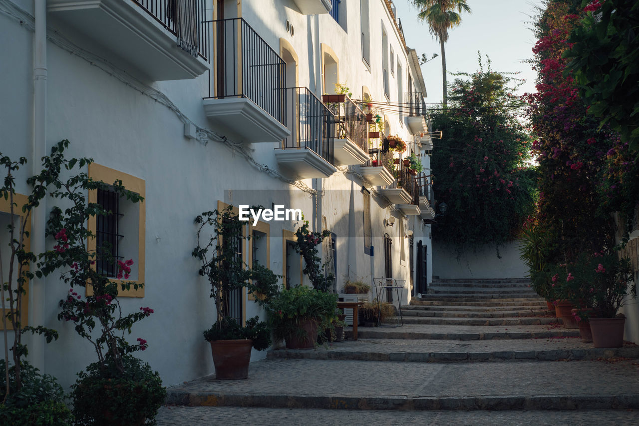 Alley amidst houses and buildings in ibiza