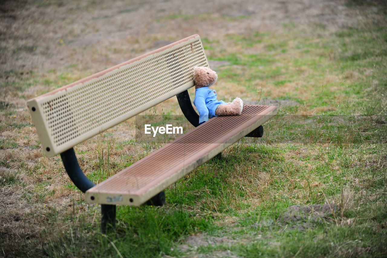 Toy on bench outdoors