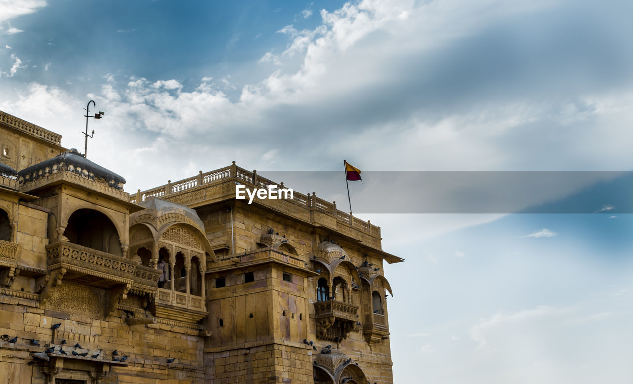 Low angle view of jaisalmer fort  against blue sky