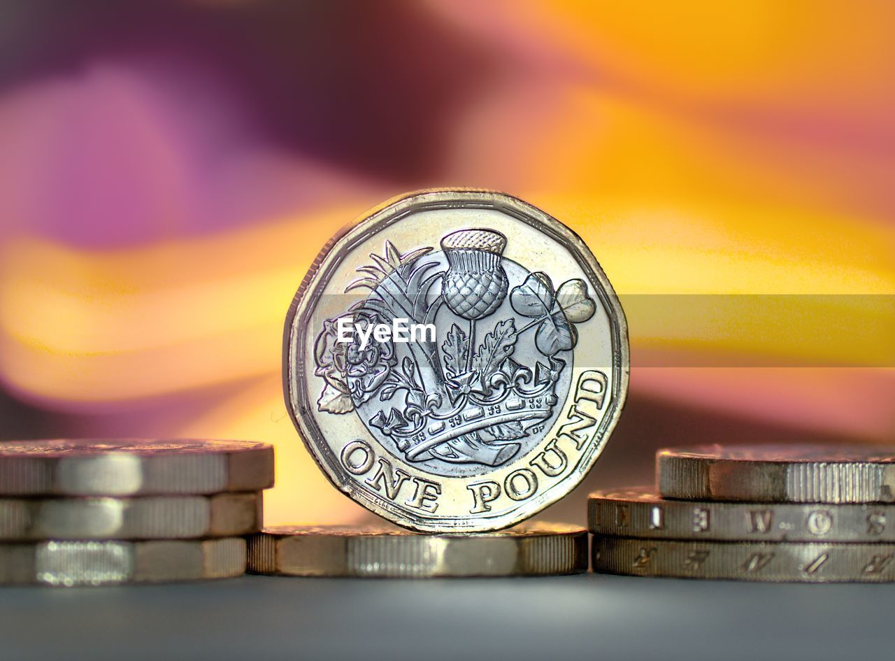 CLOSE-UP OF COIN ON METAL