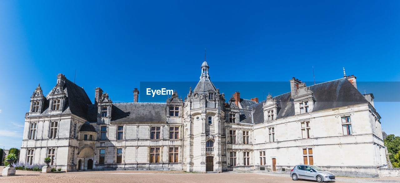 low angle view of historic building against blue sky