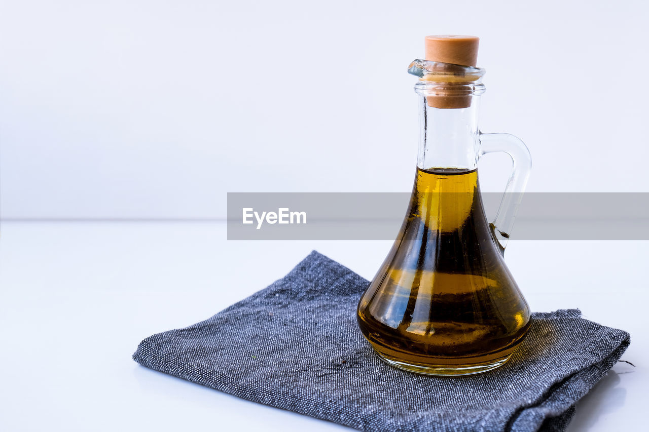 Fresh and delicious olive oil on kitchen towel. ingredients for food cooking. healthy eating. keto 