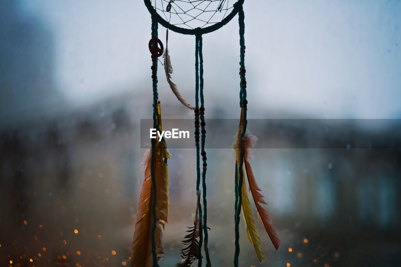 Handmade dreamcatcher, made by husband, hanging in our window on a another rainy evening