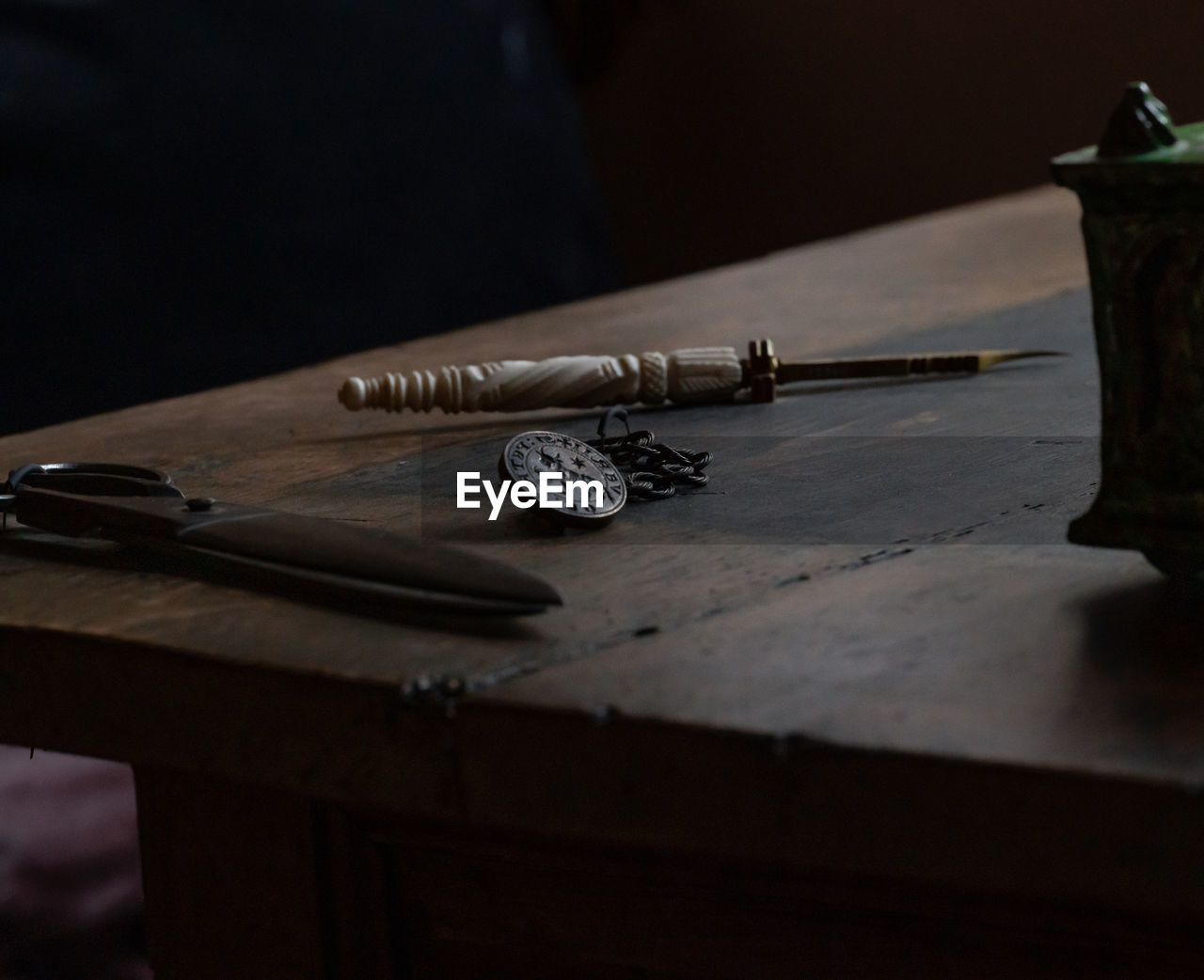 wood, indoors, table, guitar, weapon, no people, firearm, still life, work tool, black, metal, darkness, plucked string instruments