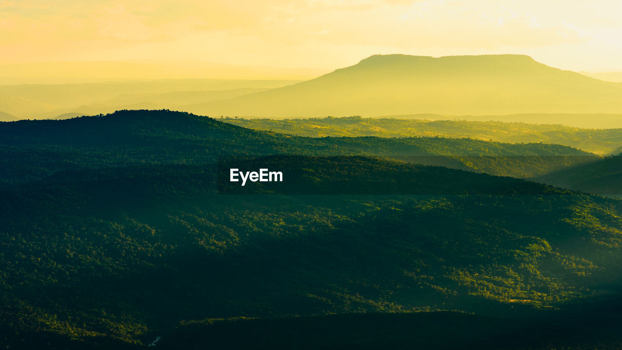 SCENIC VIEW OF MOUNTAIN AGAINST SKY DURING SUNSET