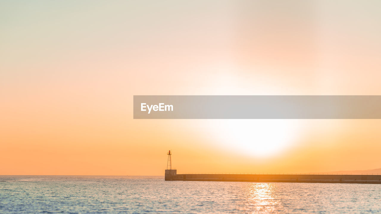 View of calm sea at sunset