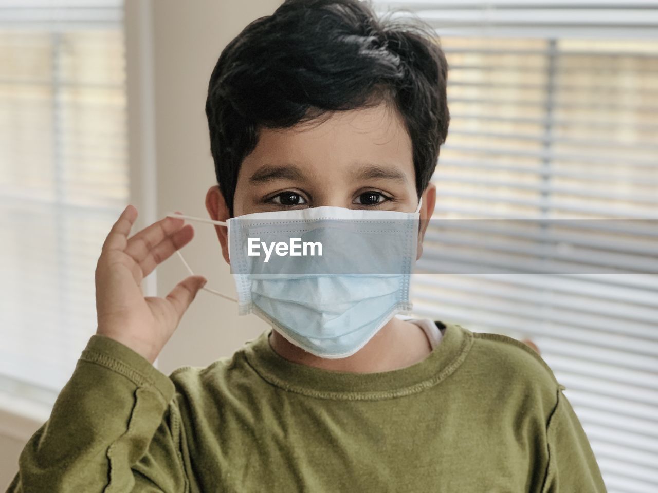 Portrait of boy wearing mask