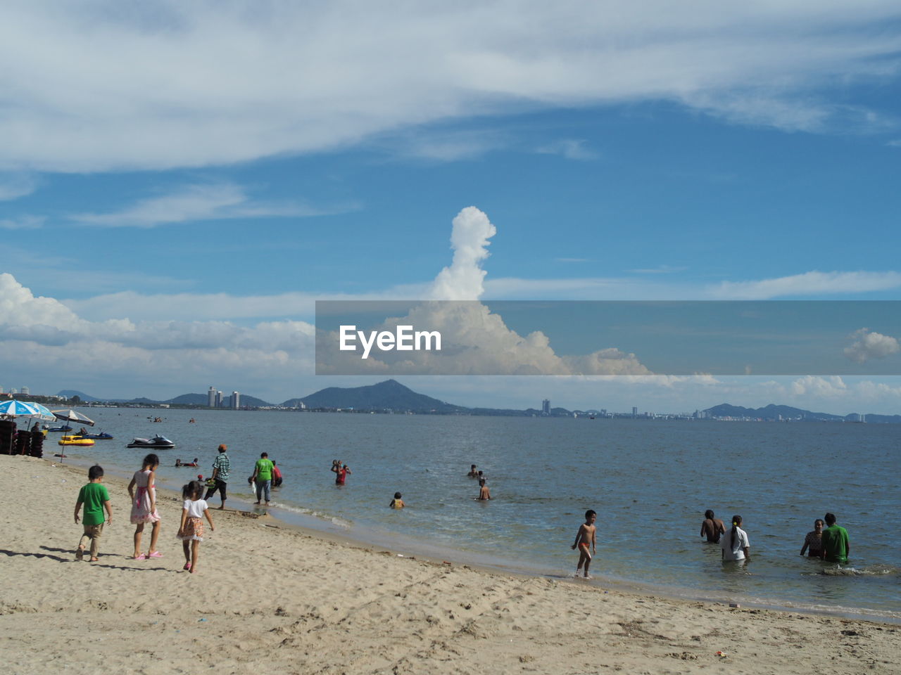 PEOPLE ENJOYING ON BEACH