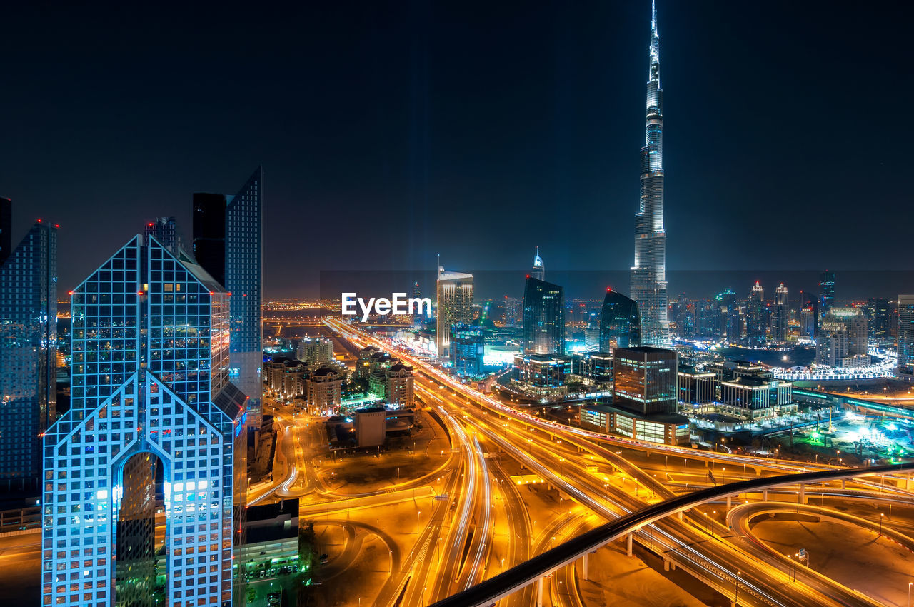 High angle view of illuminated cityscape against sky