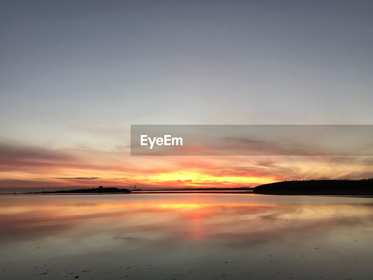 SCENIC VIEW OF SEA AGAINST ORANGE SKY