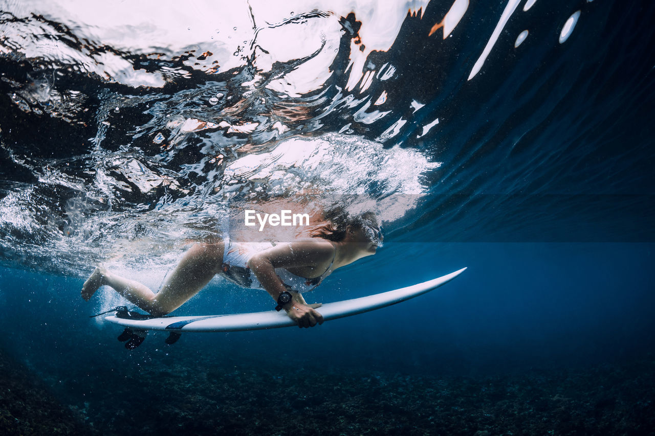 high angle view of man swimming in sea