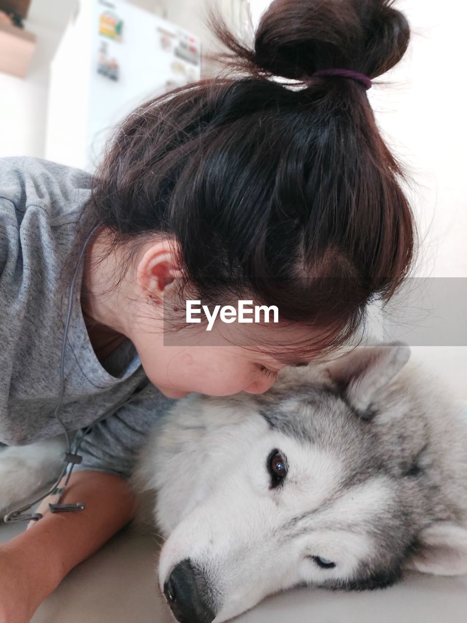 Close-up of woman embracing with dog outdoors