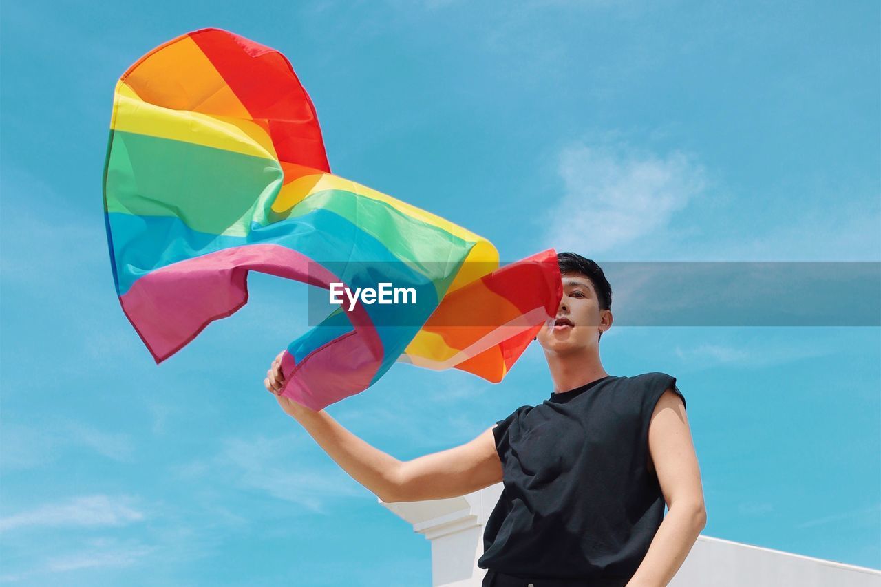 Young man waving flag.