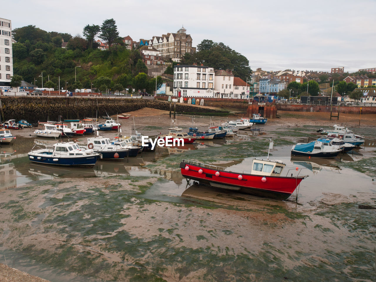 BOATS MOORED IN HARBOR