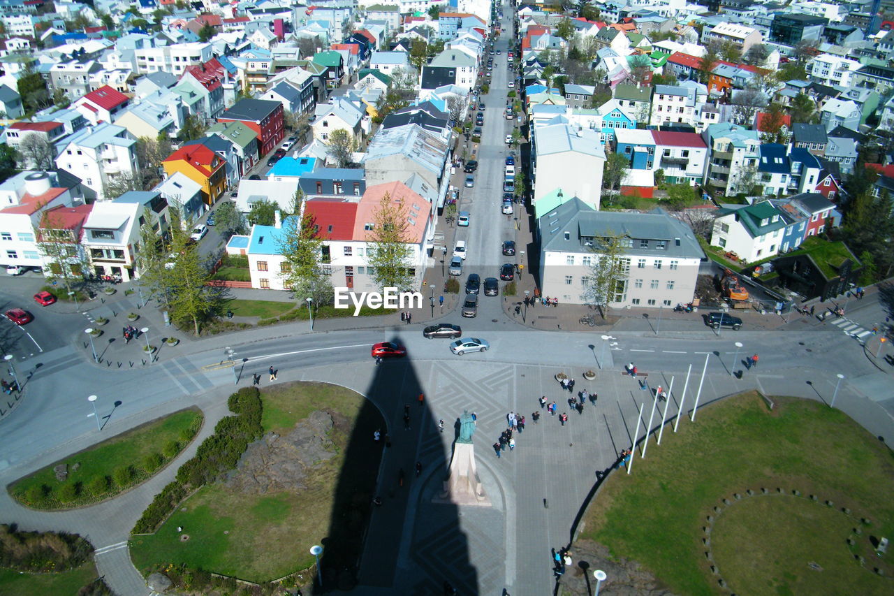 HIGH ANGLE VIEW OF PEOPLE ON STREET IN TOWN
