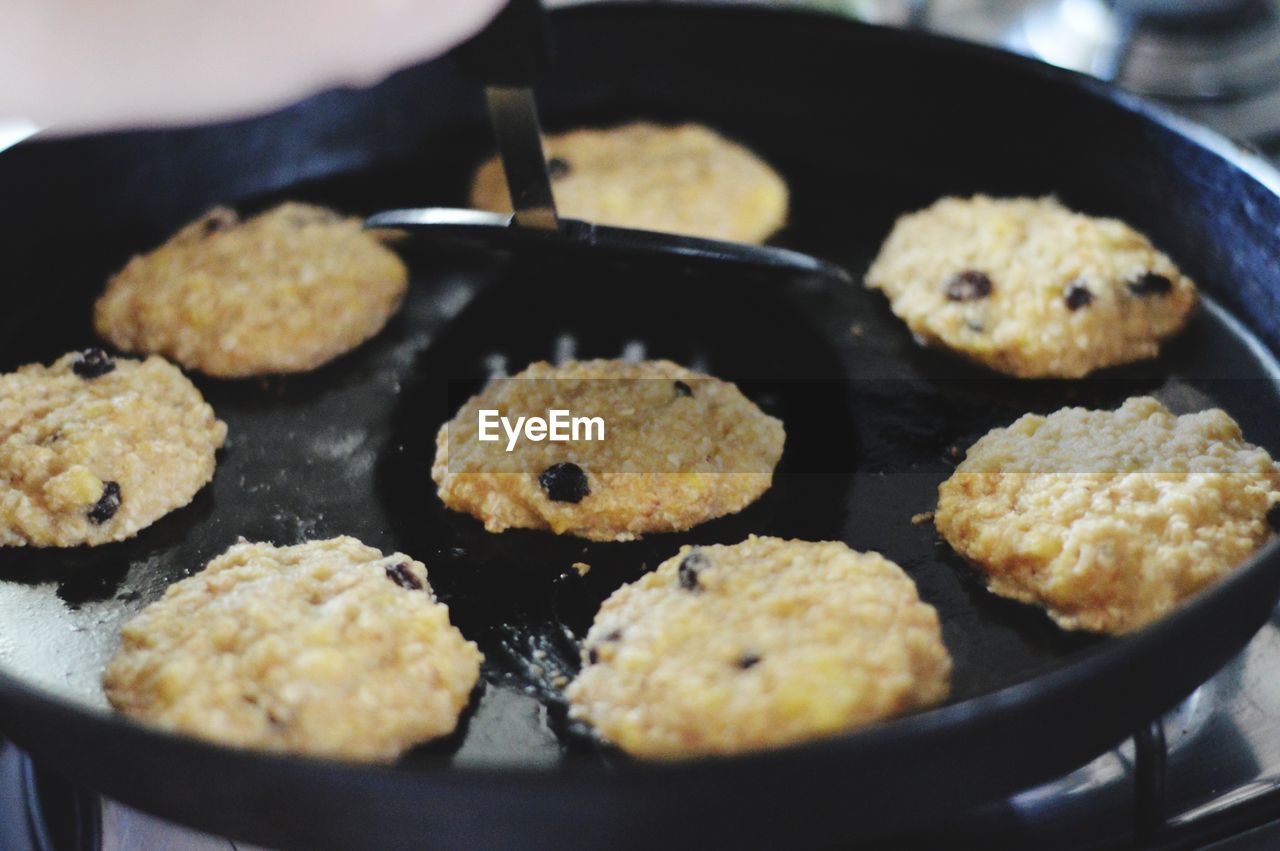 Close-up of food cooking on pan at home